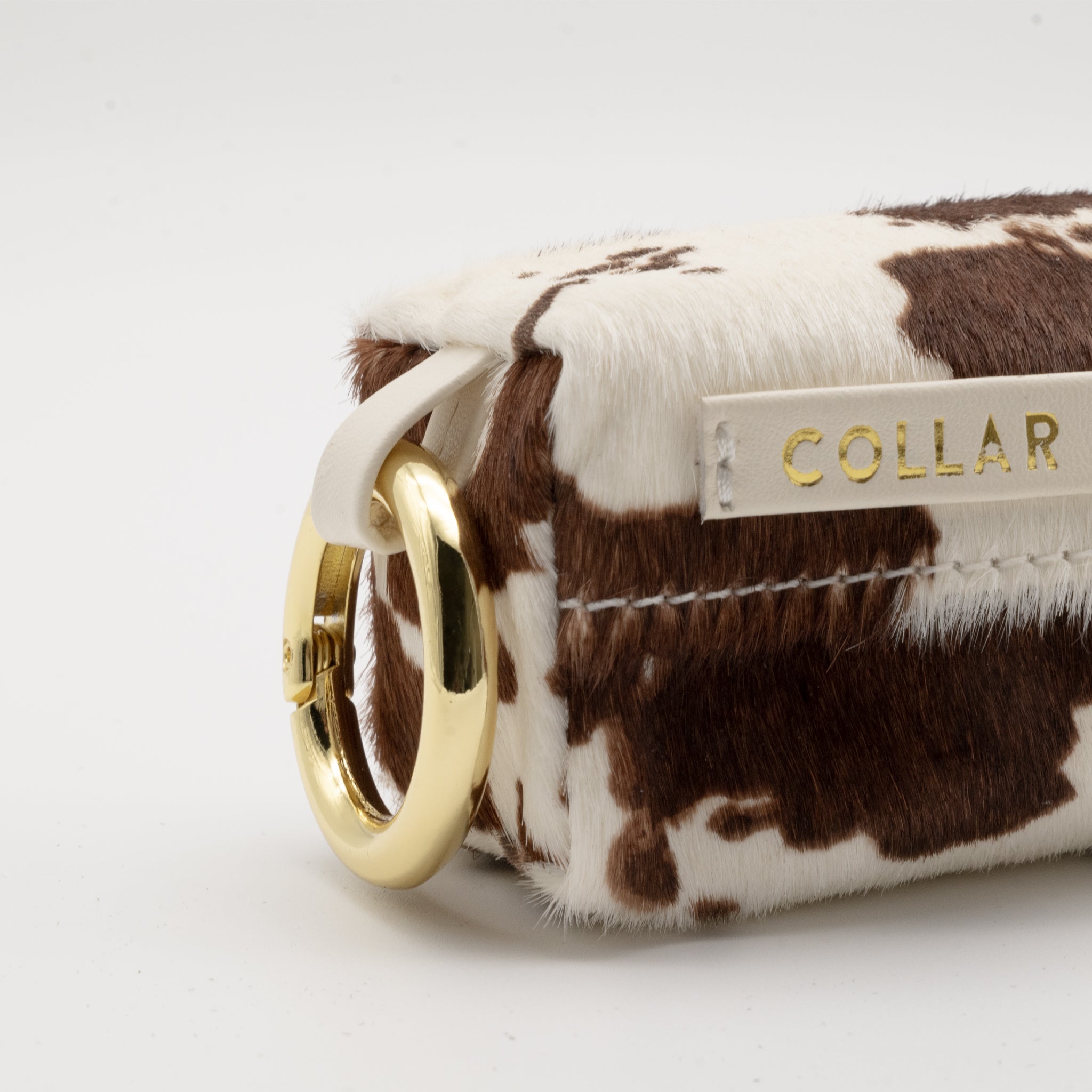 Komönstrad Bajspåsehållare